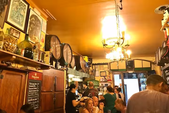 Traditional Barcelona tapas tavern interior with wine barrels, perfect for a private small group food tour