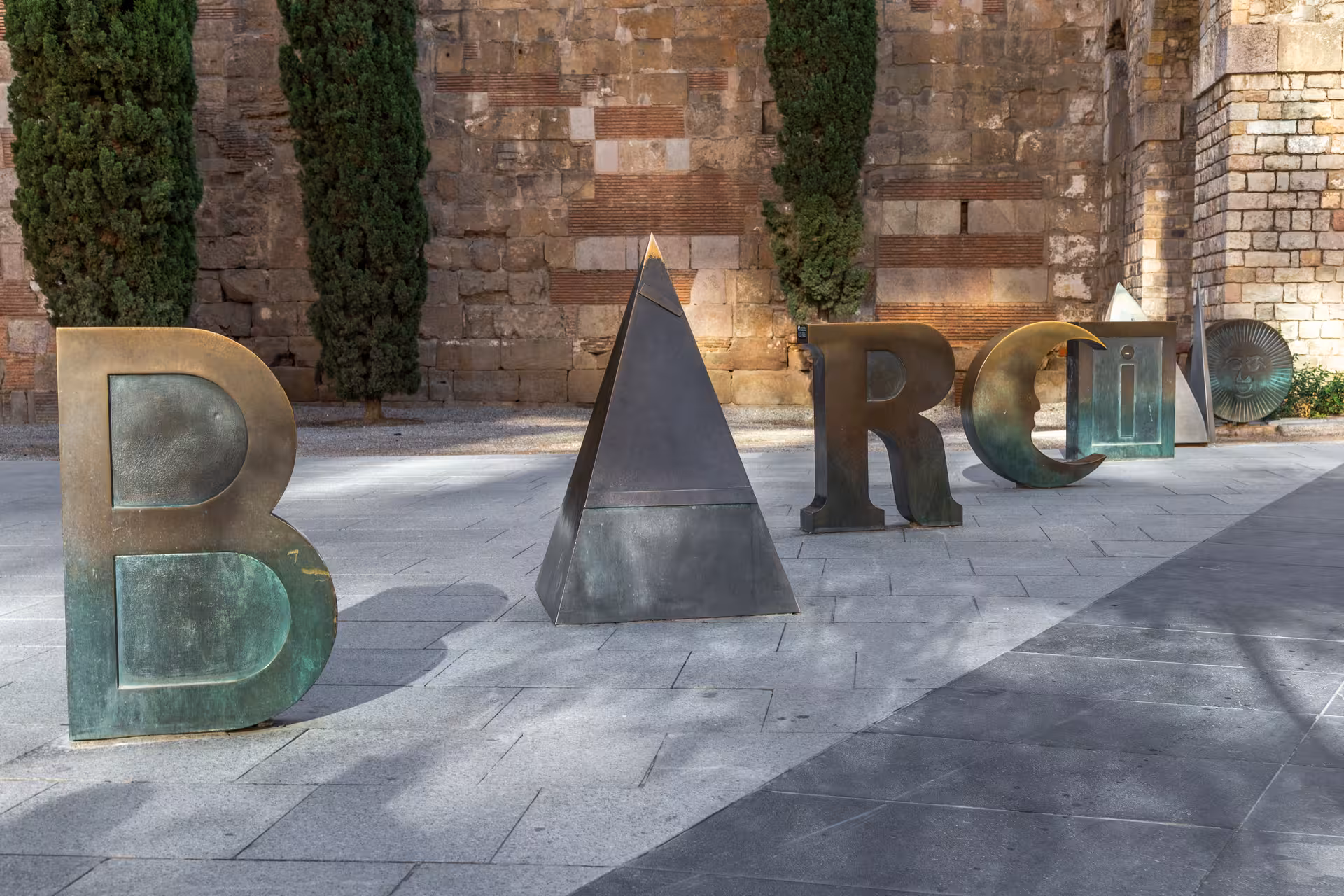 BARCINO letters near Barcelona Cathedral, Gothic Quarter landmark stop on Old Town highlights tour