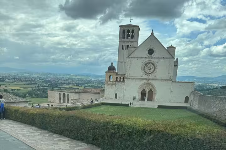 Stunning view of Basilica of St. Francis in Assisi, key highlight of Rome to Assisi day tour.