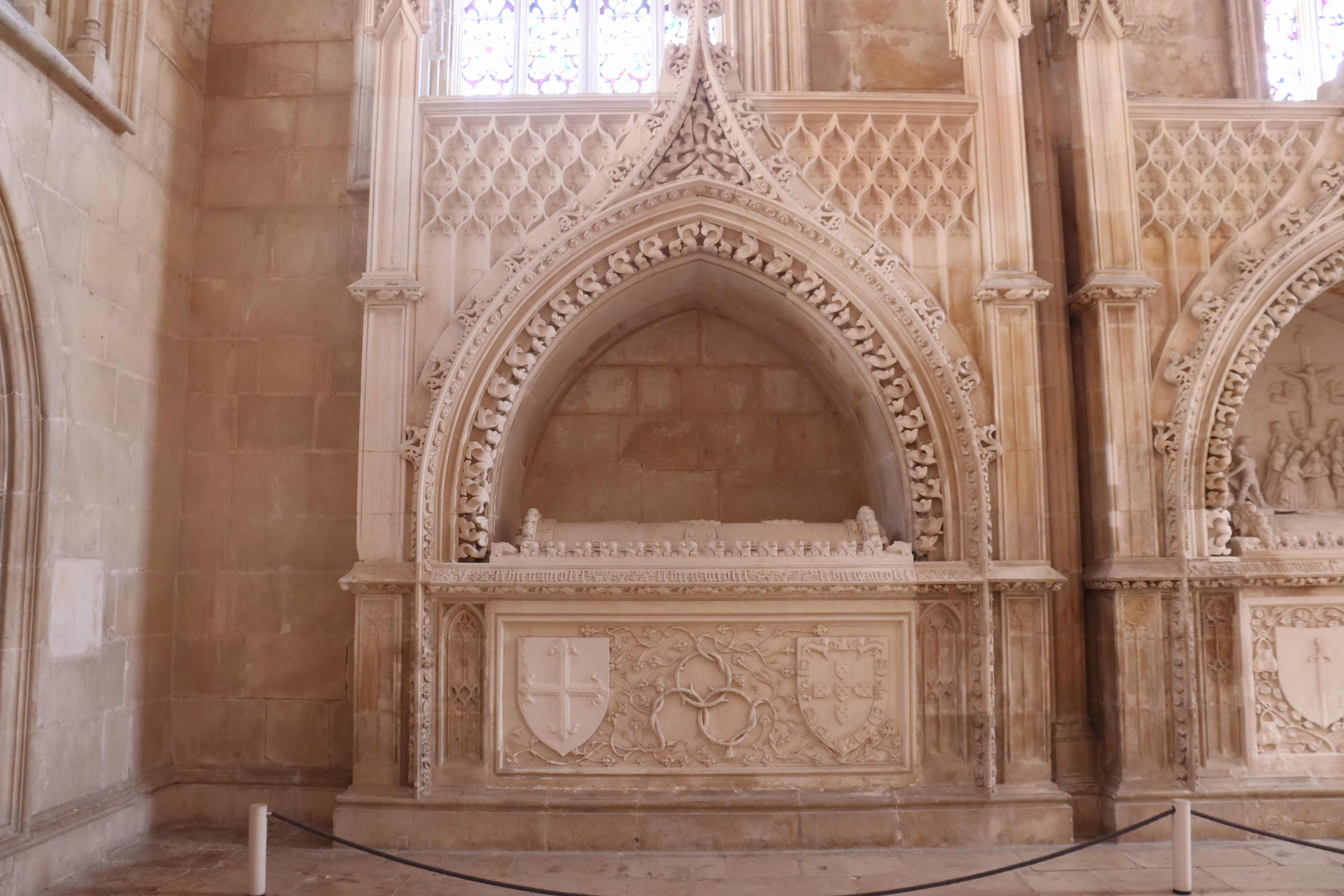 Intricate Gothic architecture inside Batalha Monastery, showcasing detailed stone carvings on a private tour of Tomar, Fátima, and Batalha.