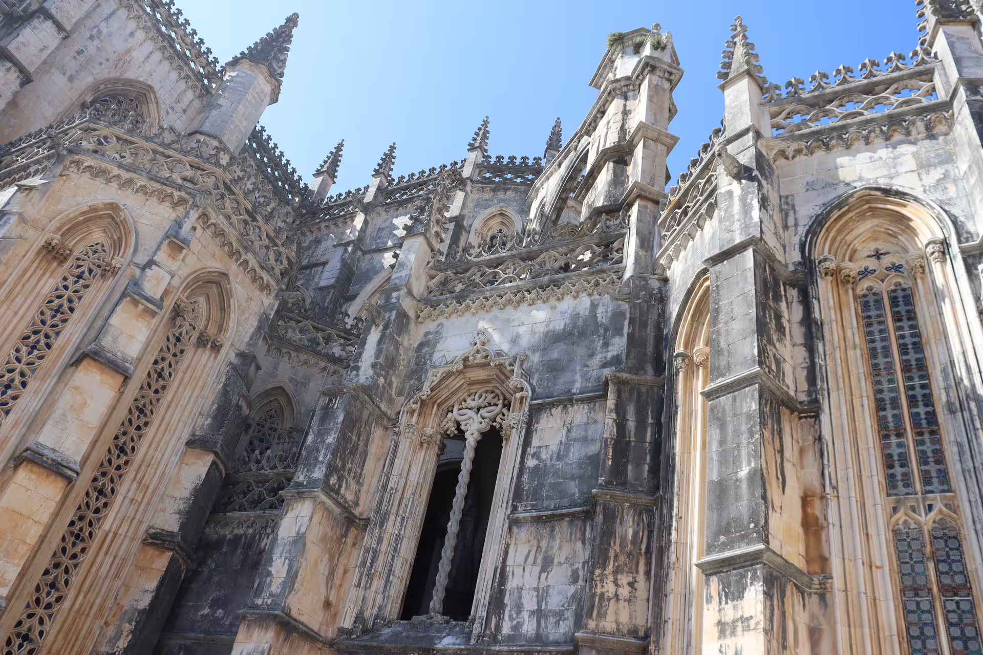 Gothic architecture of Batalha Monastery facade on a private tour through Tomar, Fátima, and Batalha historical sites.