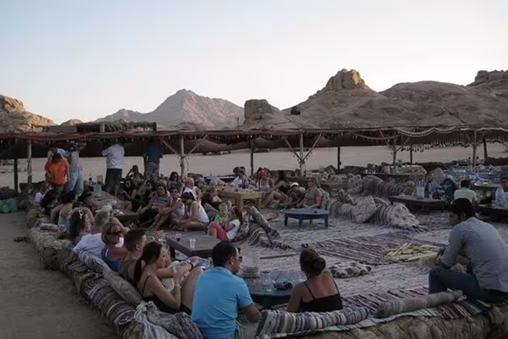 Bedouin-style desert camp near Sharm El Sheikh with cushions and sunset views, dinner show and stargazing tour