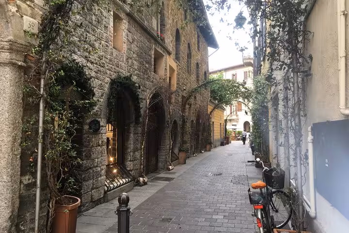 Charming cobblestone alley in Bellagio old town, walking stop on Lugano to Como Bellagio cruise plus train day tour