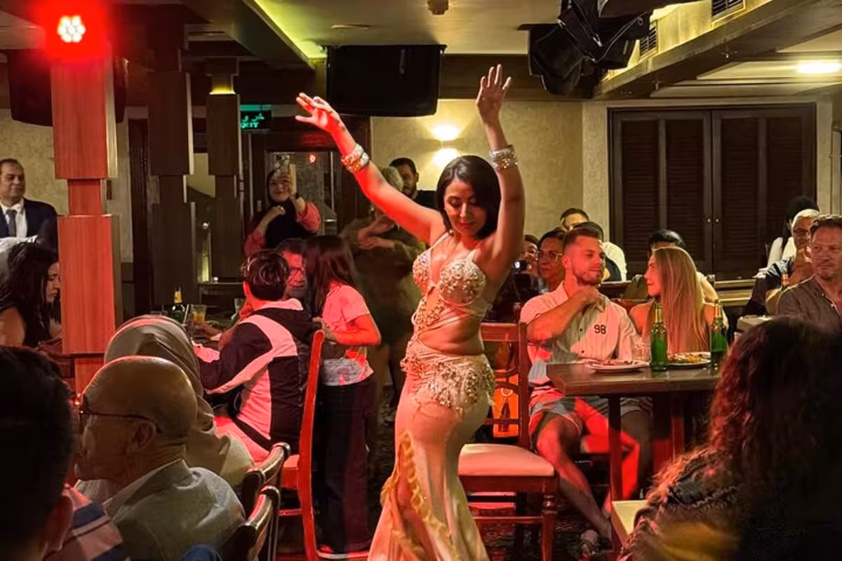 Belly dancer entertains guests during Andrea Memphis Nile dinner cruise with transfer in Cairo, Egypt