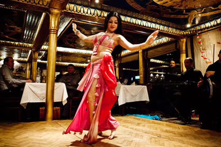 Belly dancer performing onboard Nile Maxim Cairo Nile dinner cruise, luxury dinner and live entertainment show