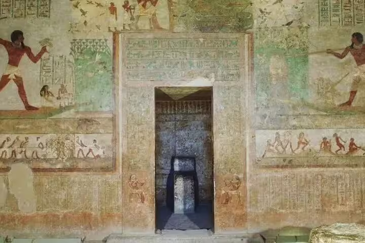 Painted tomb wall and doorway at Beni Hasan necropolis, El Minya day trip from Cairo by private car
