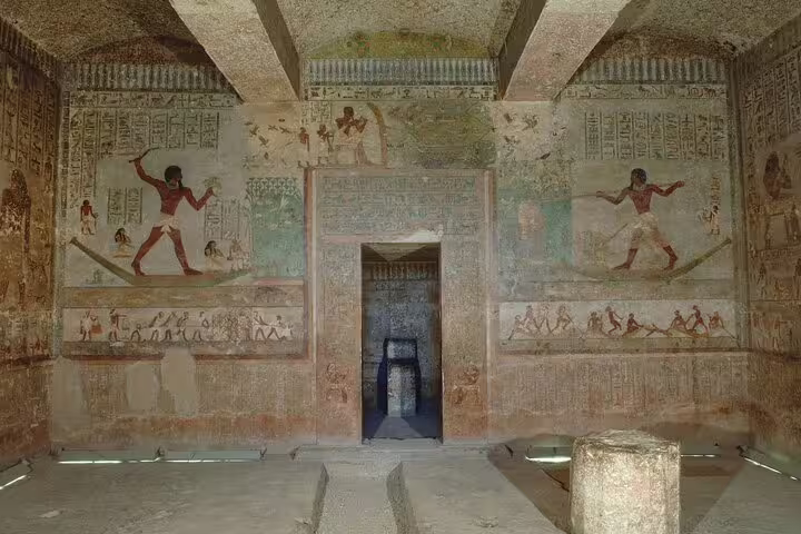Painted tomb chamber at Beni Hasan, El Minya Day Tour from Cairo by car, with vivid ancient Egyptian wall art