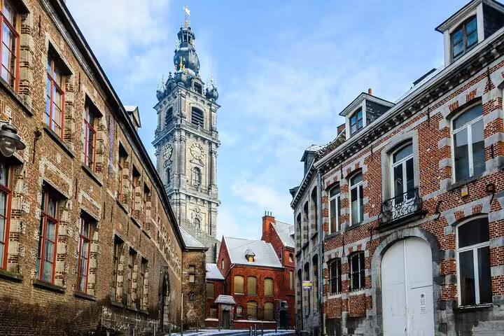 Historic street view in Bergen (Mons) with belfry tower, a key stop on the e-scavenger hunt city walk