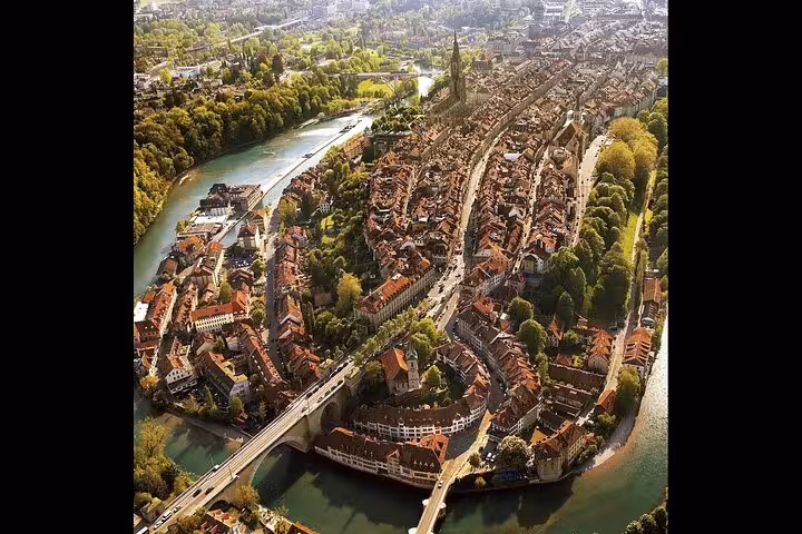 Aerial view of Bern's historic old town with winding river, perfect for Swiss Travel Pass Tours exploration.