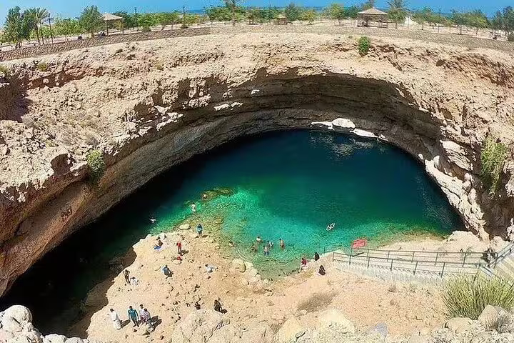 Explore the stunning turquoise waters of Bimmah Sinkhole on the 5 Days 4 Nights Oman Package Tour Mohammed.