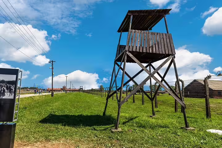 Birkenau wooden guard tower and perimeter fence, Krakow to Auschwitz-Birkenau private transfer