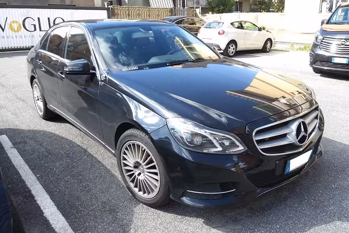 Luxurious black Mercedes sedan available for full-day rental, perfect for city tours and comfortable travel.