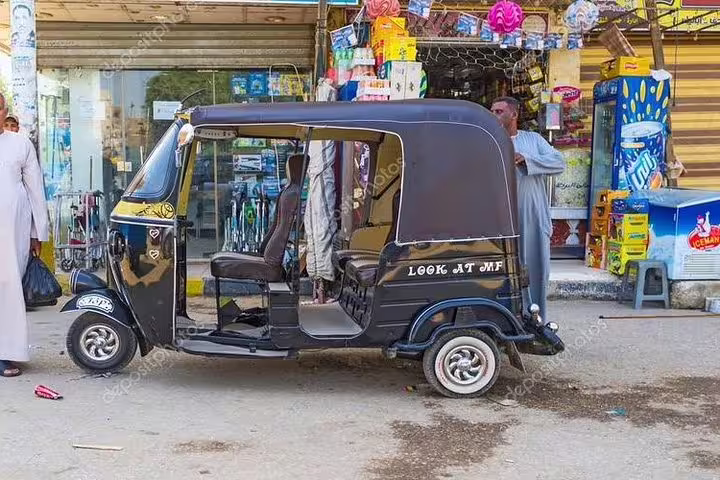 Black tuk tuk parked by a local shop in Egypt, ideal for Cairo street tuk tuk tour and city sightseeing