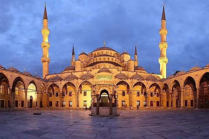 Discover the magnificent Blue Mosque at dusk, showcasing its impressive architecture and vibrant history in Istanbul.
