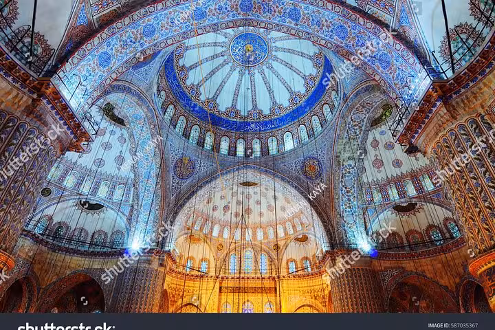 Blue Mosque interior dome with Iznik tiles and arches, highlight of Istanbul Byzantine Ottoman city tour