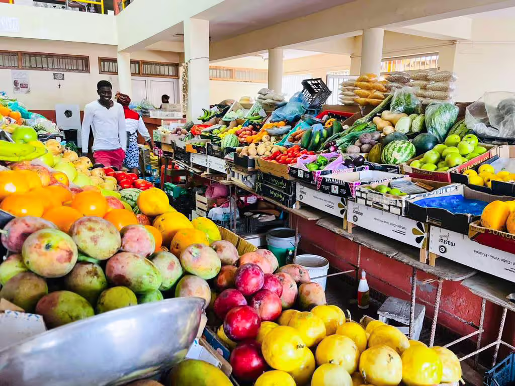 Vibrant fruit market in Boa Vista offering an array of fresh produce, a highlight for visitors on the island tour.