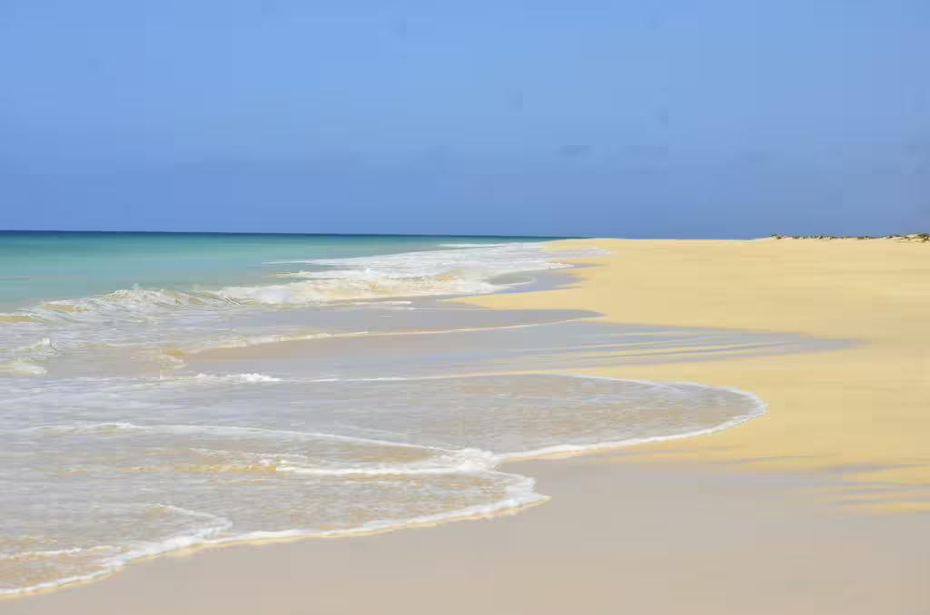 Pristine Santa Monica Beach on Boa Vista Island with golden sands and turquoise waters ideal for quad tours.