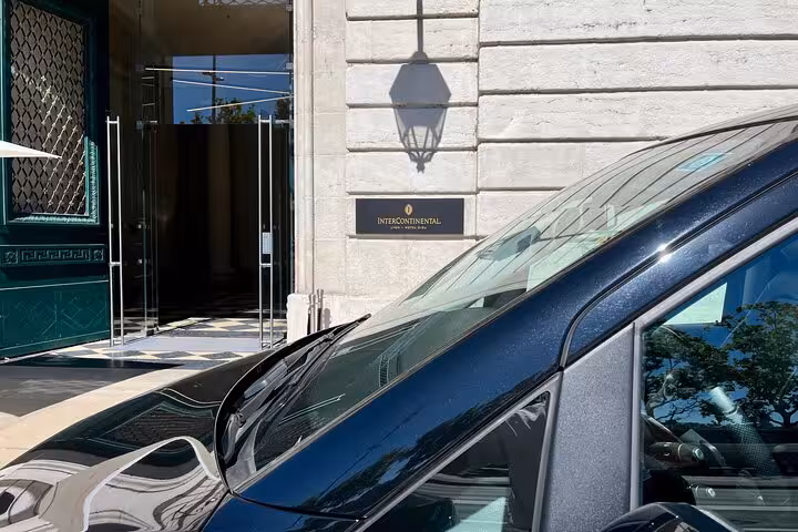 Close-up of Mercedes van at Intercontinental entrance for Bologna airport to Ravenna cruise terminal transfer.