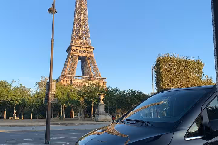 Evening scene with luxury van parked outside a modern hotel, perfect for Bologna airport to Ravenna cruise terminal transfer.