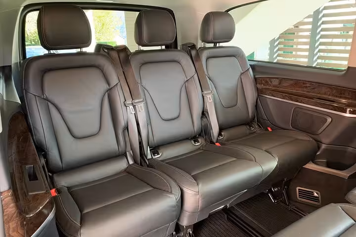 Spacious seating inside transfer vehicle for Bologna airport to Ravenna cruise terminal route.