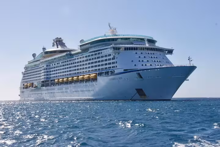 Luxurious cruise ship docked at Ravenna port for Bologna airport transfer passengers.