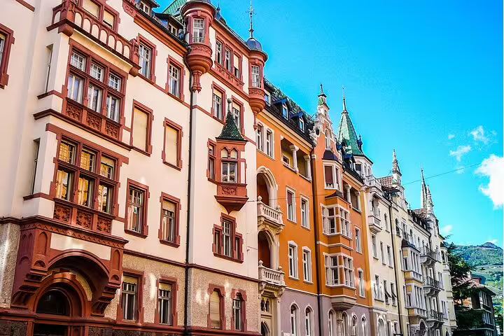 Colorful Bolzano city center architecture on a self-guided scavenger hunt and highlights walking tour in South Tyrol