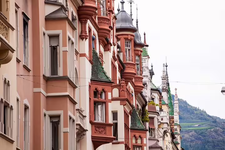 Colorful historic facades in Bolzano old town, ideal for a self-guided scavenger hunt highlights tour