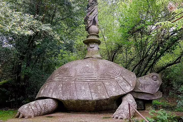 Giant stone turtle sculpture in Bomarzo Monster Park, visited on Rome to Calcata and Pope Thermal Bath private tour
