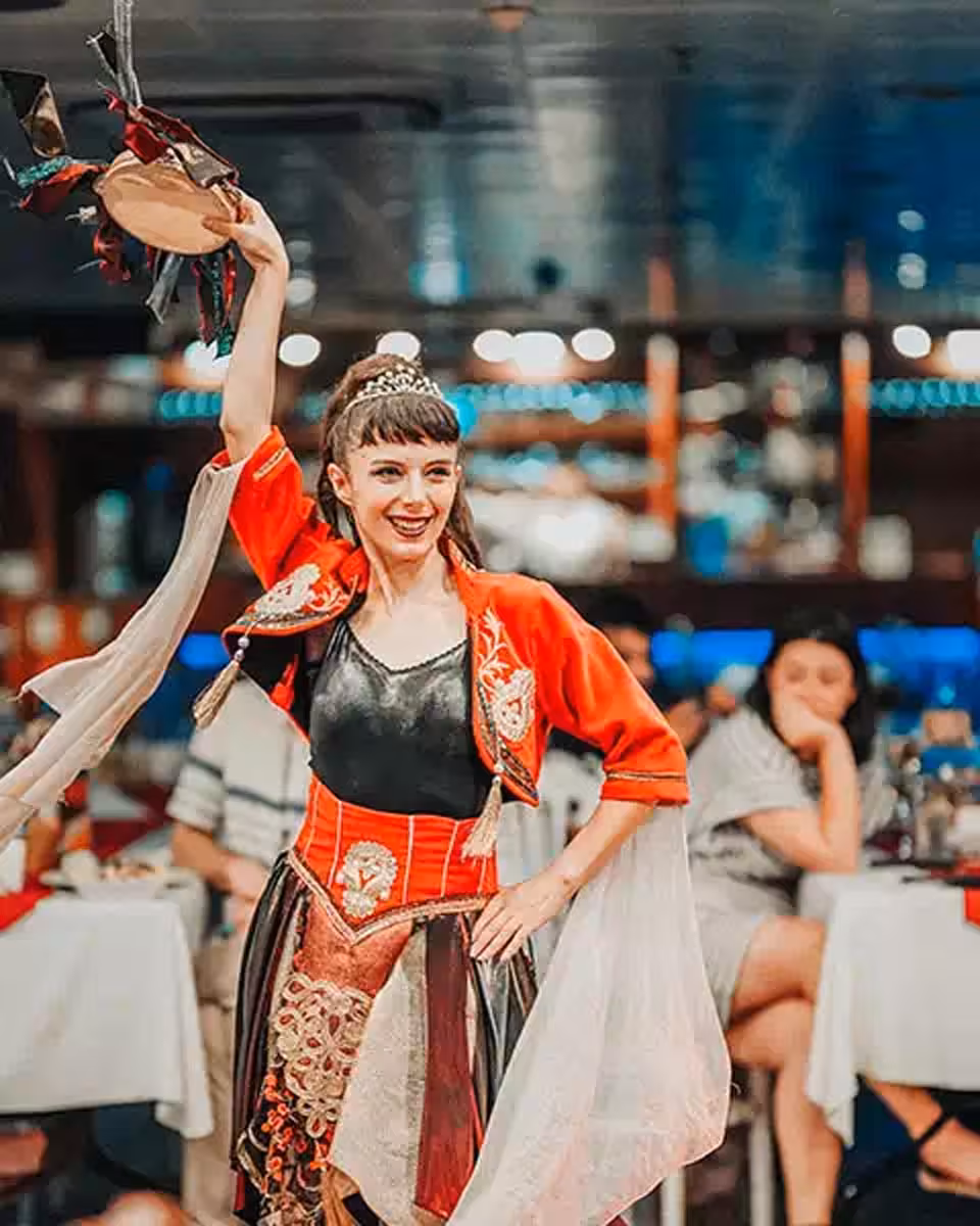 Turkish folk dancer performs on Bosphorus dinner cruise in Istanbul with live show and onboard dining