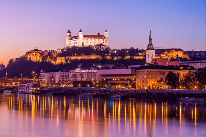 Bratislava Castle and St Martin’s Cathedral at dusk over the Danube on a self-guided scavenger hunt tour