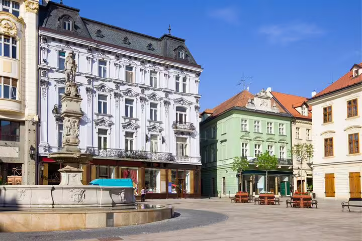 Bratislava Old Town square with historic fountain and pastel facades, ideal stop on a self-guided scavenger hunt