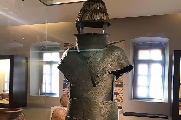 Bronze armor display at Mycenae Archaeological Museum, highlight of Epidaurus Mycenae Nafplio private tour