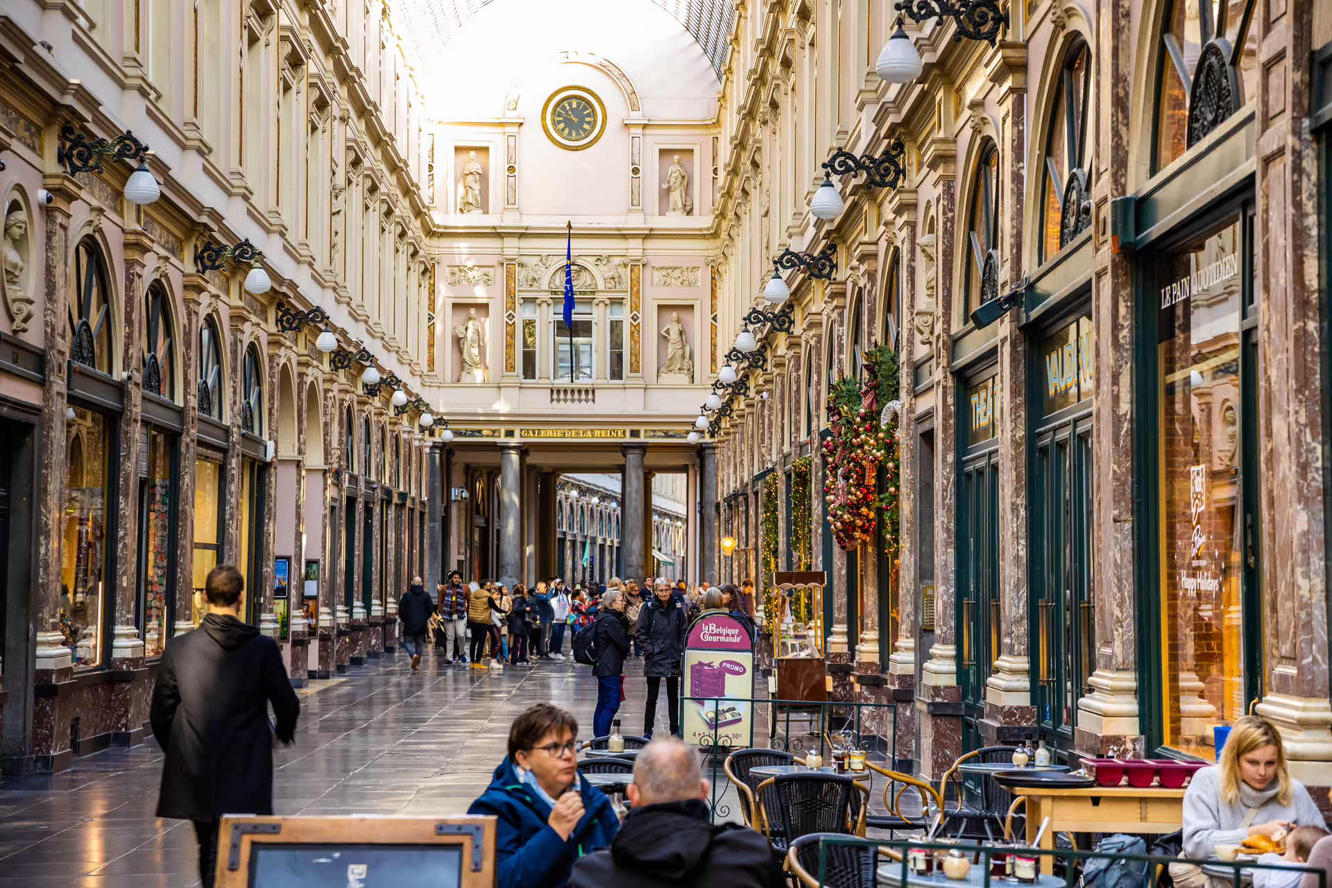 Galeries Royales Saint-Hubert arcade in Brussels with shoppers and cafes, highlight of 1-day audioguide walking tour