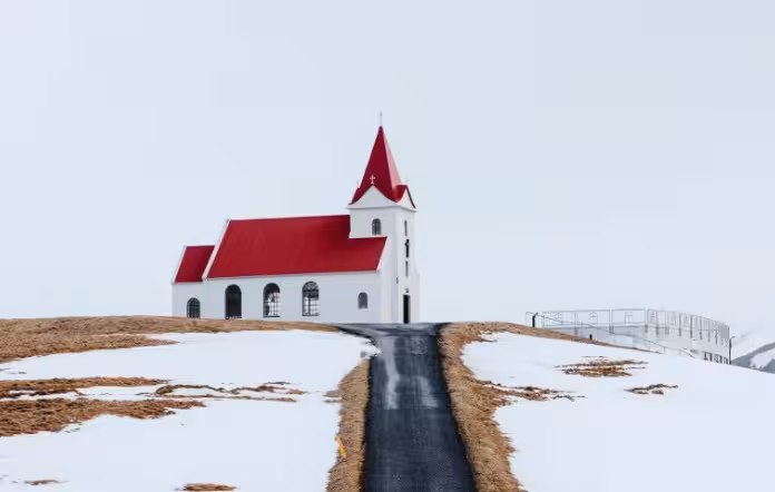 Búðakirkja black church with red roof in snowy Snæfellsnes on a private tour from Reykjavik