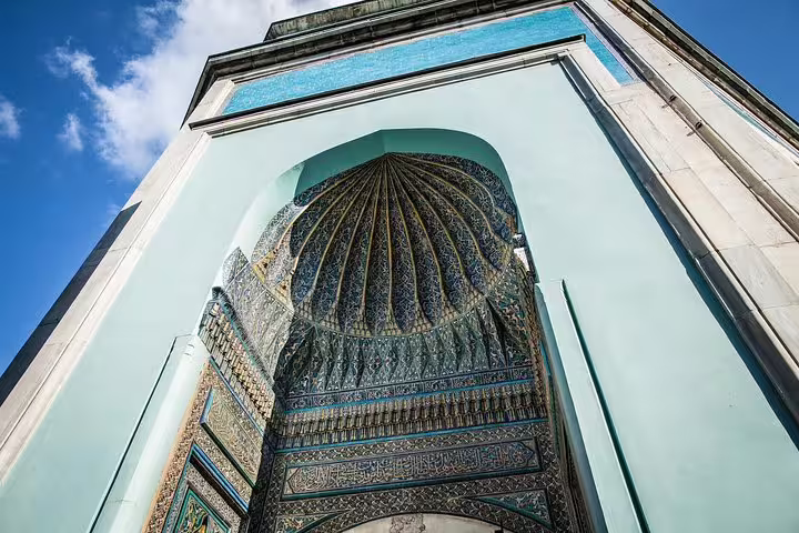 Ornate tiled arch and dome detail at Bursa Green Mosque on a private day trip from Istanbul