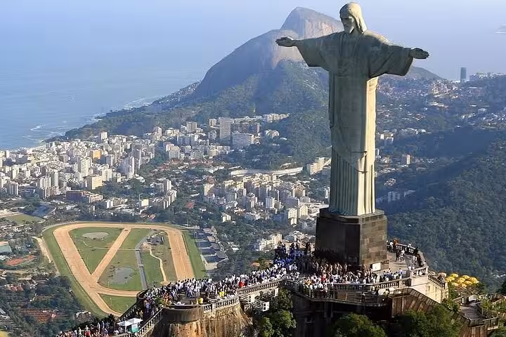 Iconic Christ the Redeemer statue overlooking Rio de Janeiro, highlighting the city's famous skyline and landmarks.