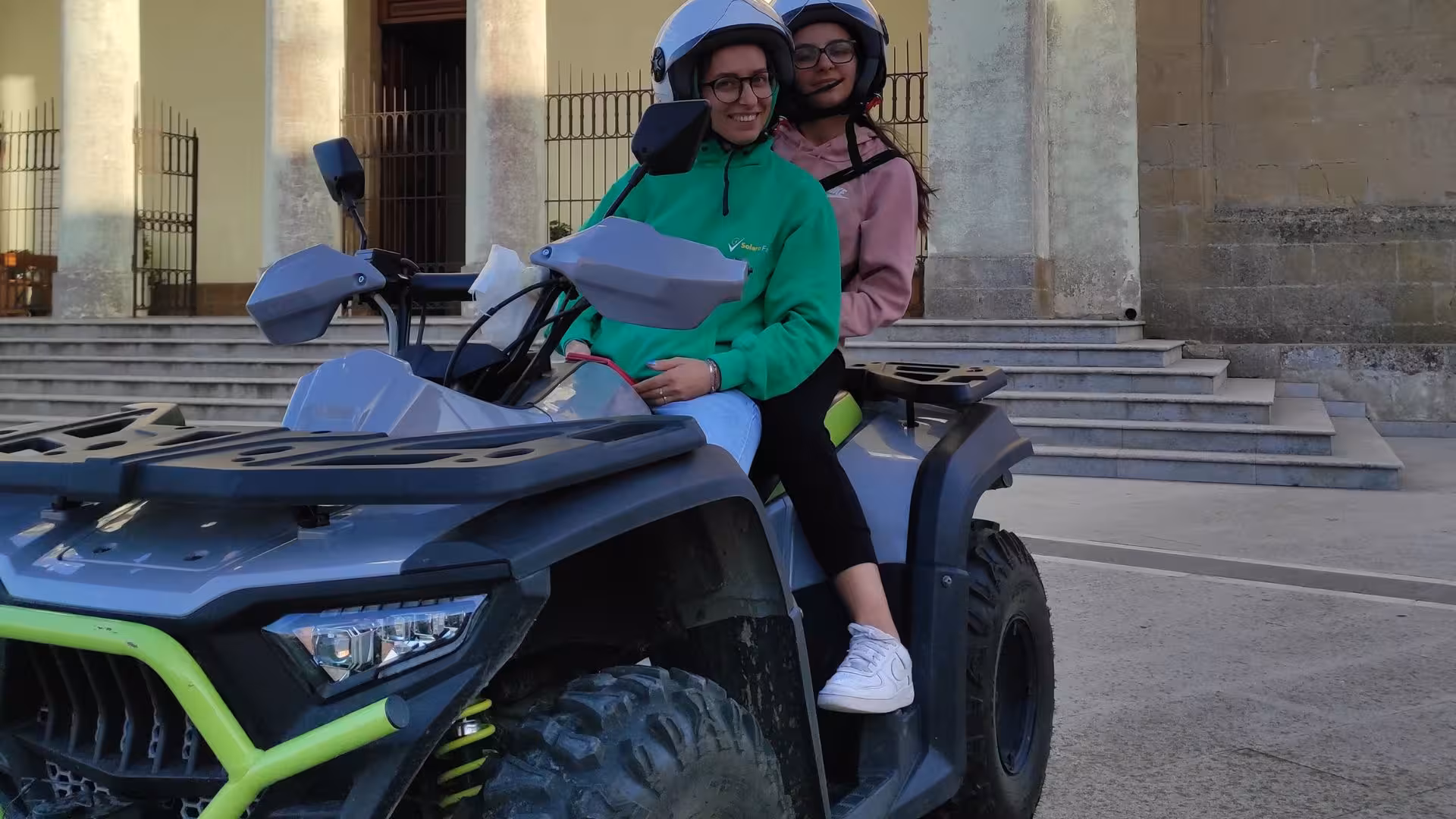 Two people on an ATV ready for an exciting Cagliari tour starting from Guasila, showcasing adventure and fun.