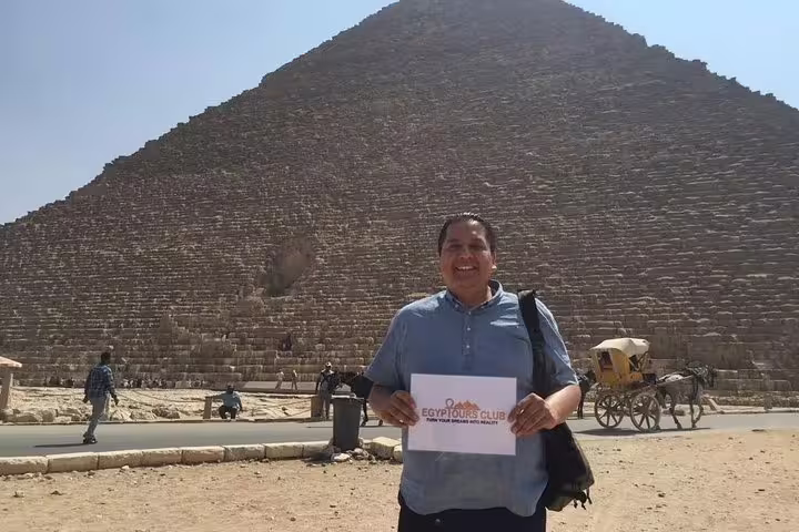 Guest at Great Pyramid of Giza on private Cairo Airport layover tour with driver, guide, and pickup