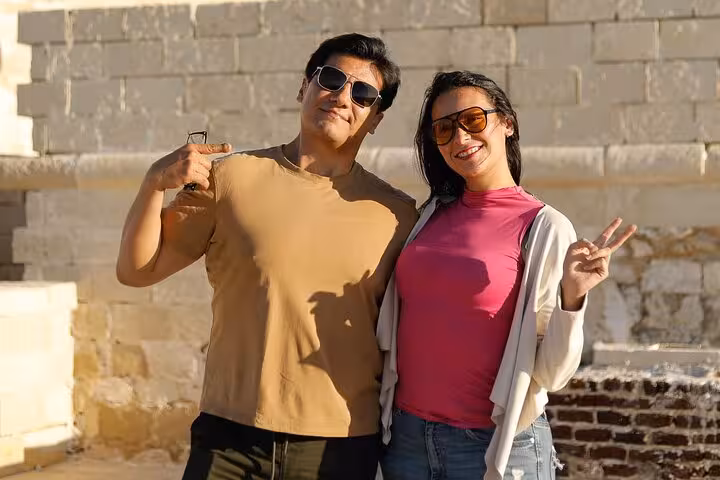 Tourists posing at Alexandria landmark on Cairo to Alexandria guided tour with entry tickets and lunch included
