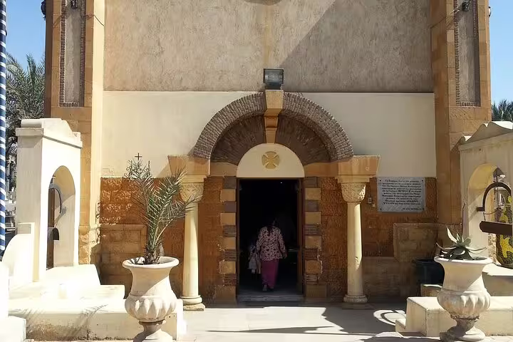 Historic Cairo church entrance with stone archway, a stop on 4-day Cairo and Red Sea tour package