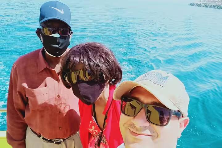 Tourists on a boat in Ain El Sokhna, Red Sea, enjoying a Cairo day trip with sea breeze and views