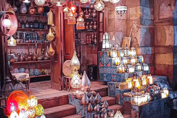 Colorful Cairo souk with handmade lanterns and brassware at Khan El Khalili on Dahab to Cairo flight day tour