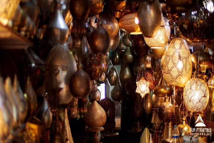 Hanging brass lanterns in Cairo Khan el-Khalili bazaar during a day tour from Alexandria with shopping stop