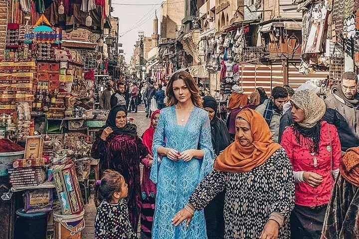 Crowded Cairo street bazaar with locals and stalls, ideal for a Cairo local market tour shopping walk