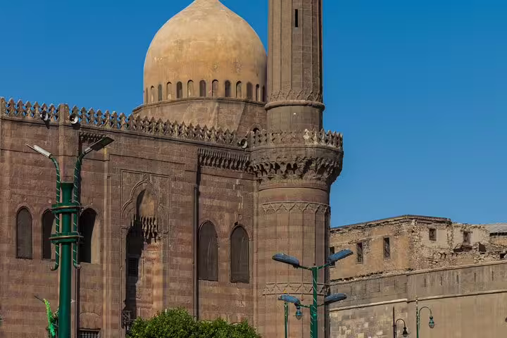 Historic Cairo mosque dome and minaret on Al-Mu'izz Street, featured on Al Azhar Park tour with dinner