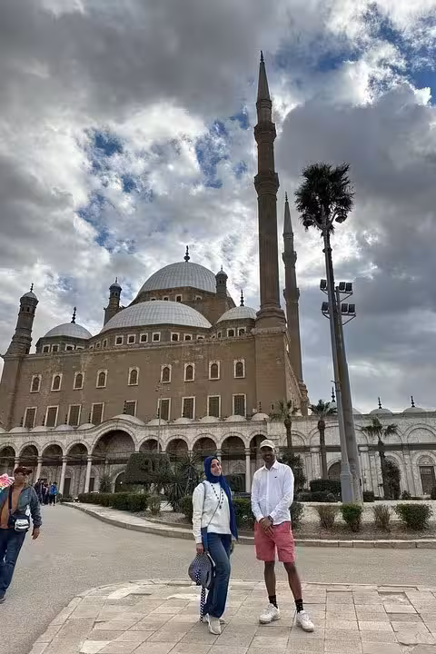 Visitors at Cairo mosque before Saqqara, Dahshur and Memphis pyramids tour, supporting stray dogs and cats