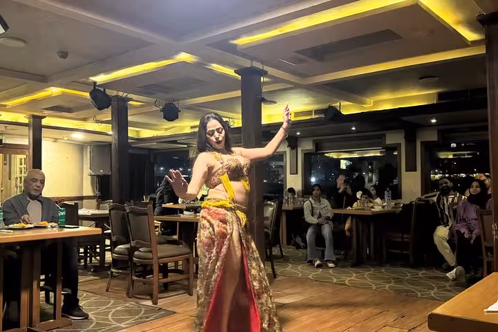 Live belly dance show during Cairo Nile dinner cruise with hotel pickup, onboard buffet dinner and nightlife