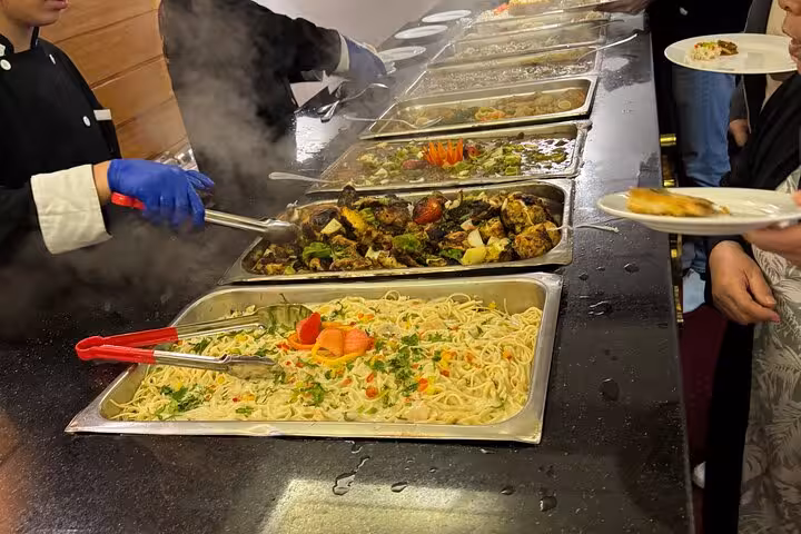 Hot buffet station on Cairo Nile dinner cruise with grilled vegetables and pasta, evening meal onboard