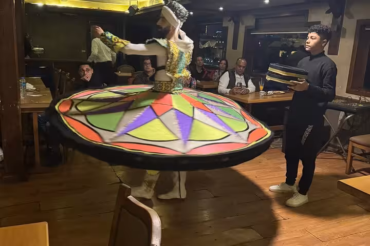 Tanoura whirling dervish show on Cairo Nile dinner cruise with hotel pickup, live music and buffet dining