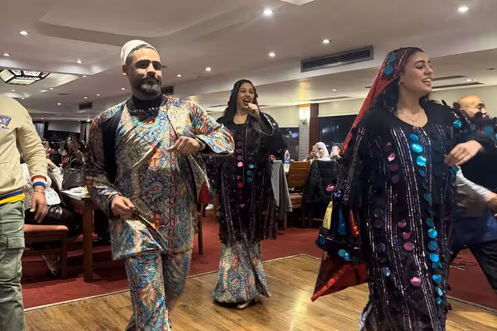 Tanoura folk dancers entertaining guests during Cairo Nile dinner cruise with hotel pickup and buffet dinner